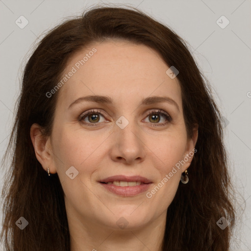 Joyful white adult female with long  brown hair and grey eyes