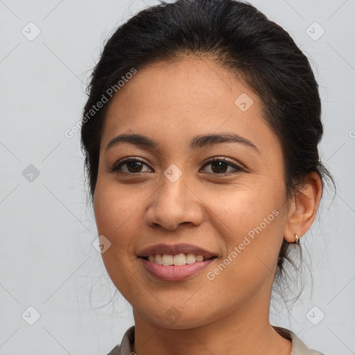 Joyful latino young-adult female with medium  brown hair and brown eyes