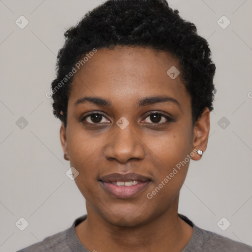 Joyful black young-adult female with short  black hair and brown eyes