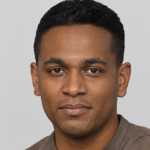 Neutral black young-adult male with short  black hair and brown eyes