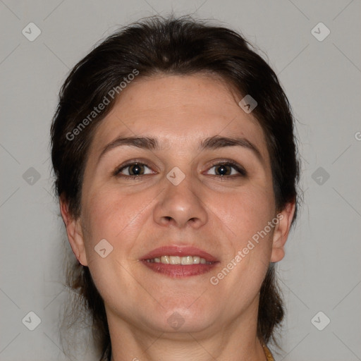 Joyful white adult female with medium  brown hair and brown eyes