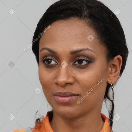 Joyful black young-adult female with short  brown hair and brown eyes