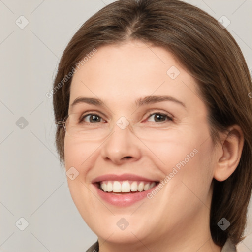 Joyful white young-adult female with medium  brown hair and grey eyes