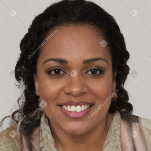 Joyful black young-adult female with long  brown hair and brown eyes