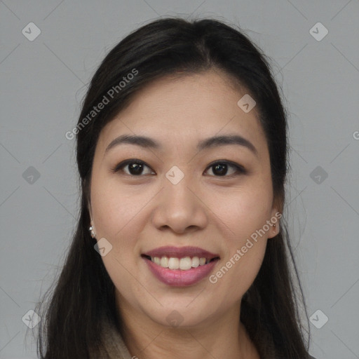 Joyful latino young-adult female with long  brown hair and brown eyes