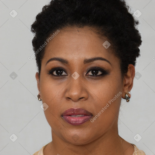 Joyful black young-adult female with short  brown hair and brown eyes