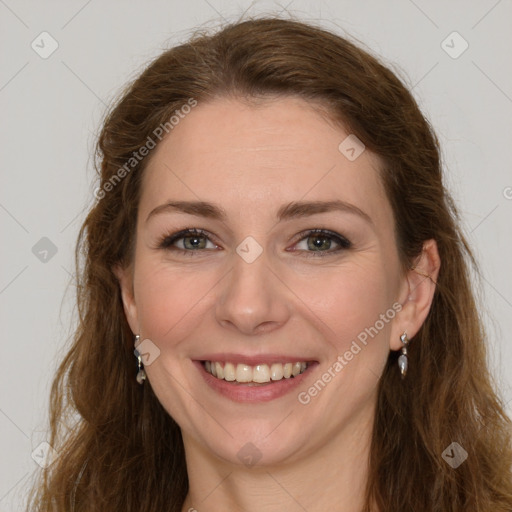 Joyful white young-adult female with long  brown hair and green eyes