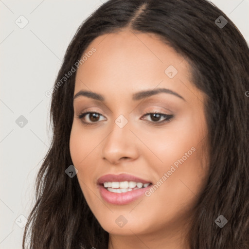 Joyful white young-adult female with long  black hair and brown eyes