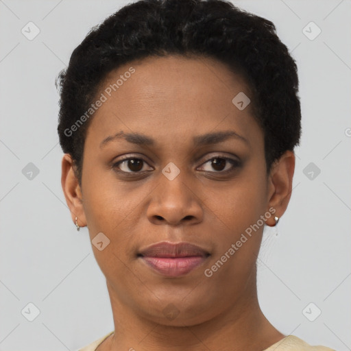 Joyful black young-adult female with short  black hair and brown eyes