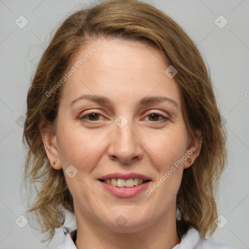 Joyful white adult female with medium  brown hair and brown eyes