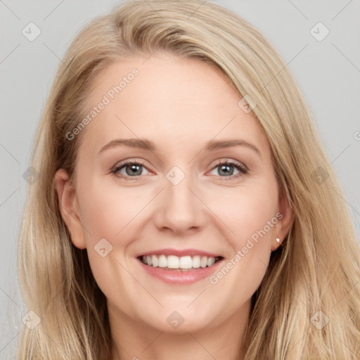 Joyful white young-adult female with long  brown hair and blue eyes