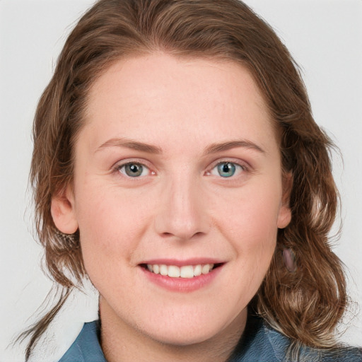 Joyful white young-adult female with medium  brown hair and blue eyes