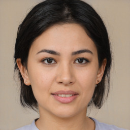 Joyful asian young-adult female with medium  brown hair and brown eyes