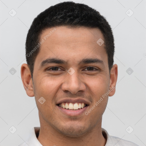 Joyful latino young-adult male with short  brown hair and brown eyes