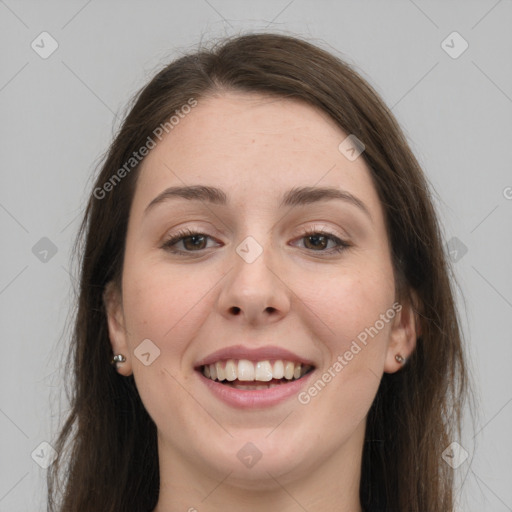 Joyful white young-adult female with long  brown hair and grey eyes