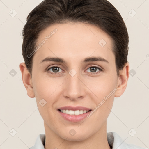 Joyful white young-adult female with short  brown hair and brown eyes