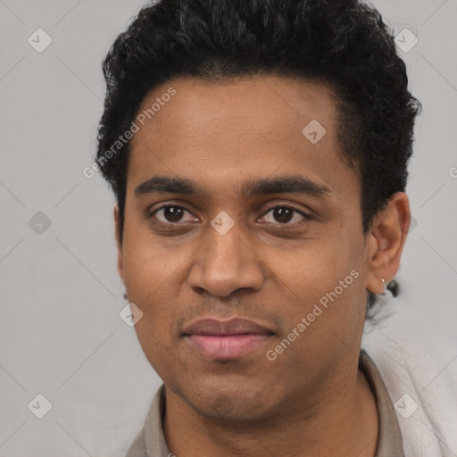 Joyful black young-adult male with short  black hair and brown eyes