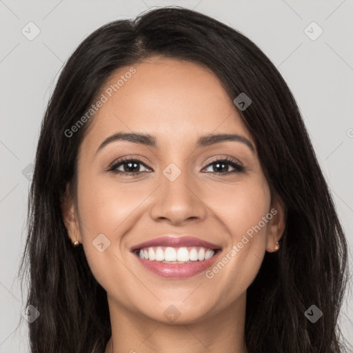 Joyful white young-adult female with long  black hair and brown eyes