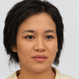 Neutral asian young-adult female with medium  brown hair and brown eyes