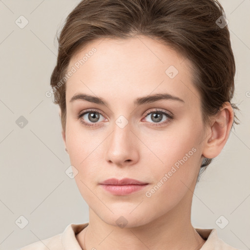 Neutral white young-adult female with short  brown hair and grey eyes