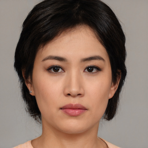 Neutral asian young-adult female with medium  brown hair and brown eyes