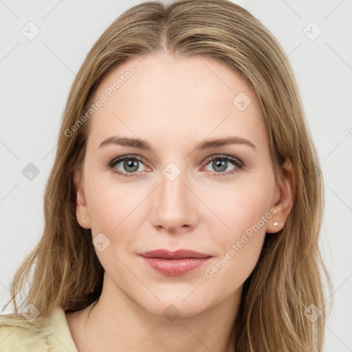 Joyful white young-adult female with long  brown hair and blue eyes