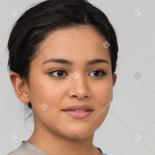 Joyful latino young-adult female with long  brown hair and brown eyes