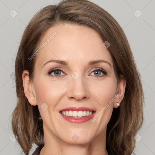 Joyful white adult female with medium  brown hair and grey eyes