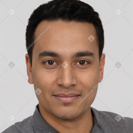 Joyful latino young-adult male with short  black hair and brown eyes