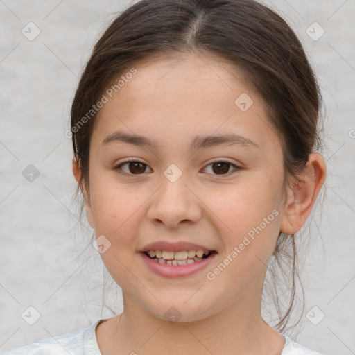 Joyful white child female with medium  brown hair and brown eyes