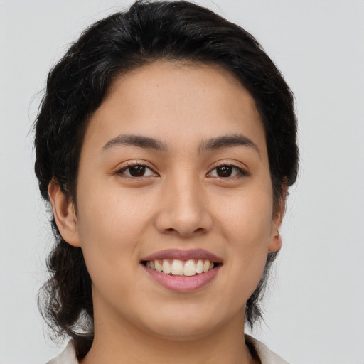 Joyful asian young-adult female with medium  brown hair and brown eyes