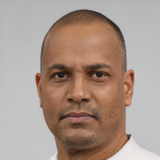 Neutral black adult male with short  brown hair and brown eyes