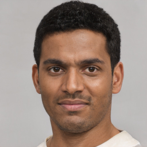 Neutral black young-adult male with short  black hair and brown eyes