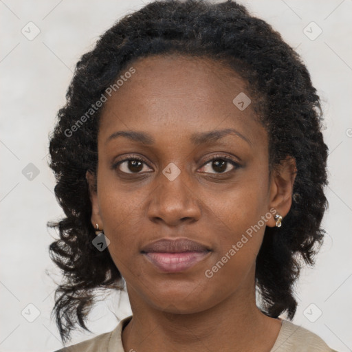 Joyful black young-adult female with long  brown hair and brown eyes