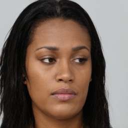 Joyful asian young-adult female with long  brown hair and brown eyes