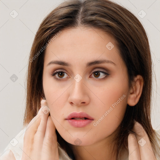 Neutral white young-adult female with long  brown hair and brown eyes