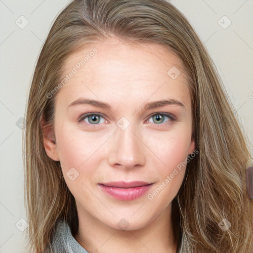 Joyful white young-adult female with long  brown hair and blue eyes