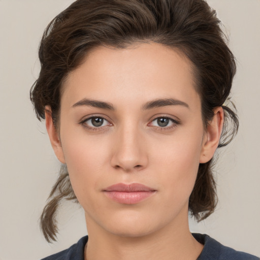 Neutral white young-adult female with medium  brown hair and brown eyes