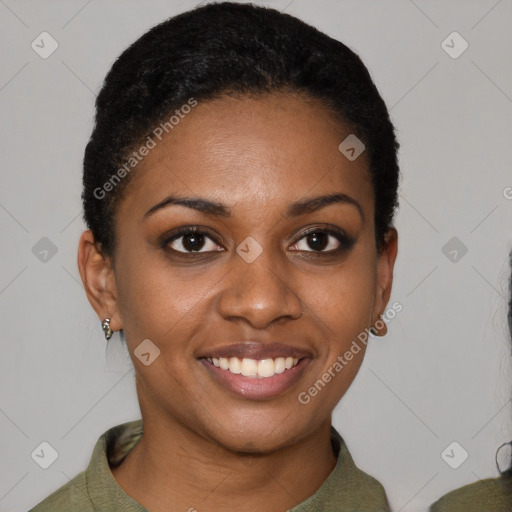 Joyful black young-adult female with short  black hair and brown eyes