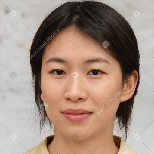 Joyful asian young-adult female with medium  brown hair and brown eyes