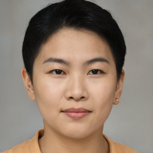 Joyful asian young-adult female with short  black hair and brown eyes