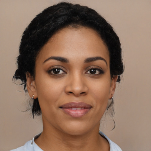 Joyful latino young-adult female with medium  black hair and brown eyes
