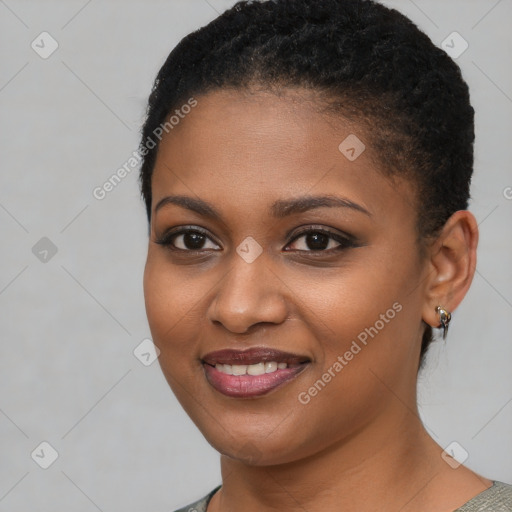 Joyful black young-adult female with short  brown hair and brown eyes