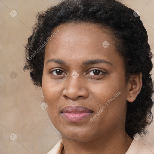 Joyful black adult female with medium  brown hair and brown eyes