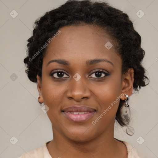 Joyful black young-adult female with medium  black hair and brown eyes