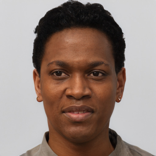 Joyful black young-adult female with short  black hair and brown eyes