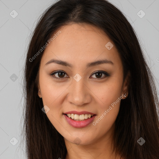 Joyful latino young-adult female with long  brown hair and brown eyes