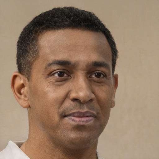 Neutral latino adult male with short  brown hair and brown eyes
