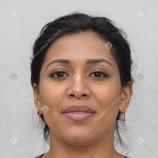 Joyful latino young-adult female with medium  brown hair and brown eyes