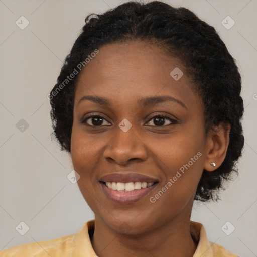 Joyful black young-adult female with medium  brown hair and brown eyes